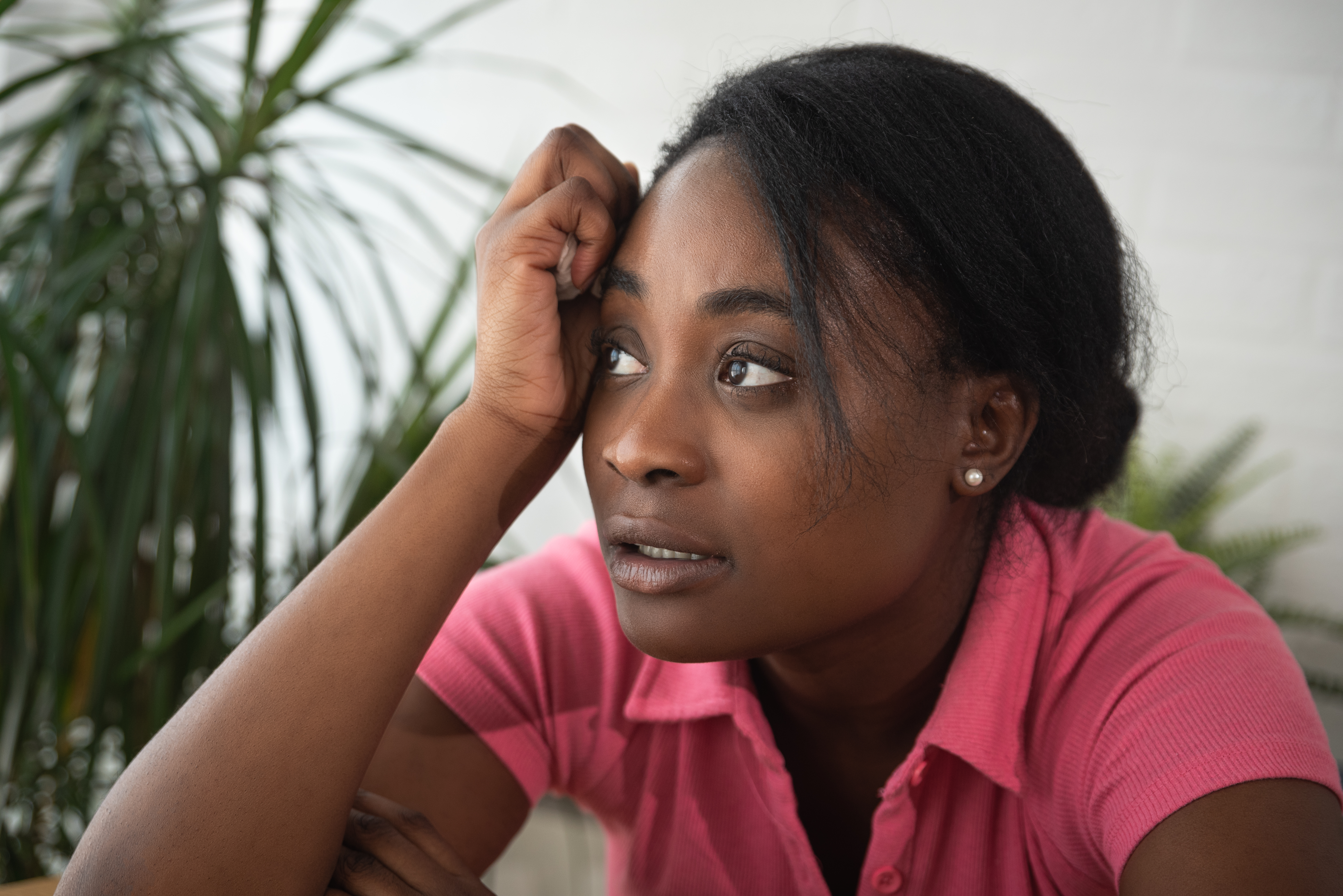 Young,Stressed,Depressed,Black,African,Lesbian,Woman,Sitting,At,Her