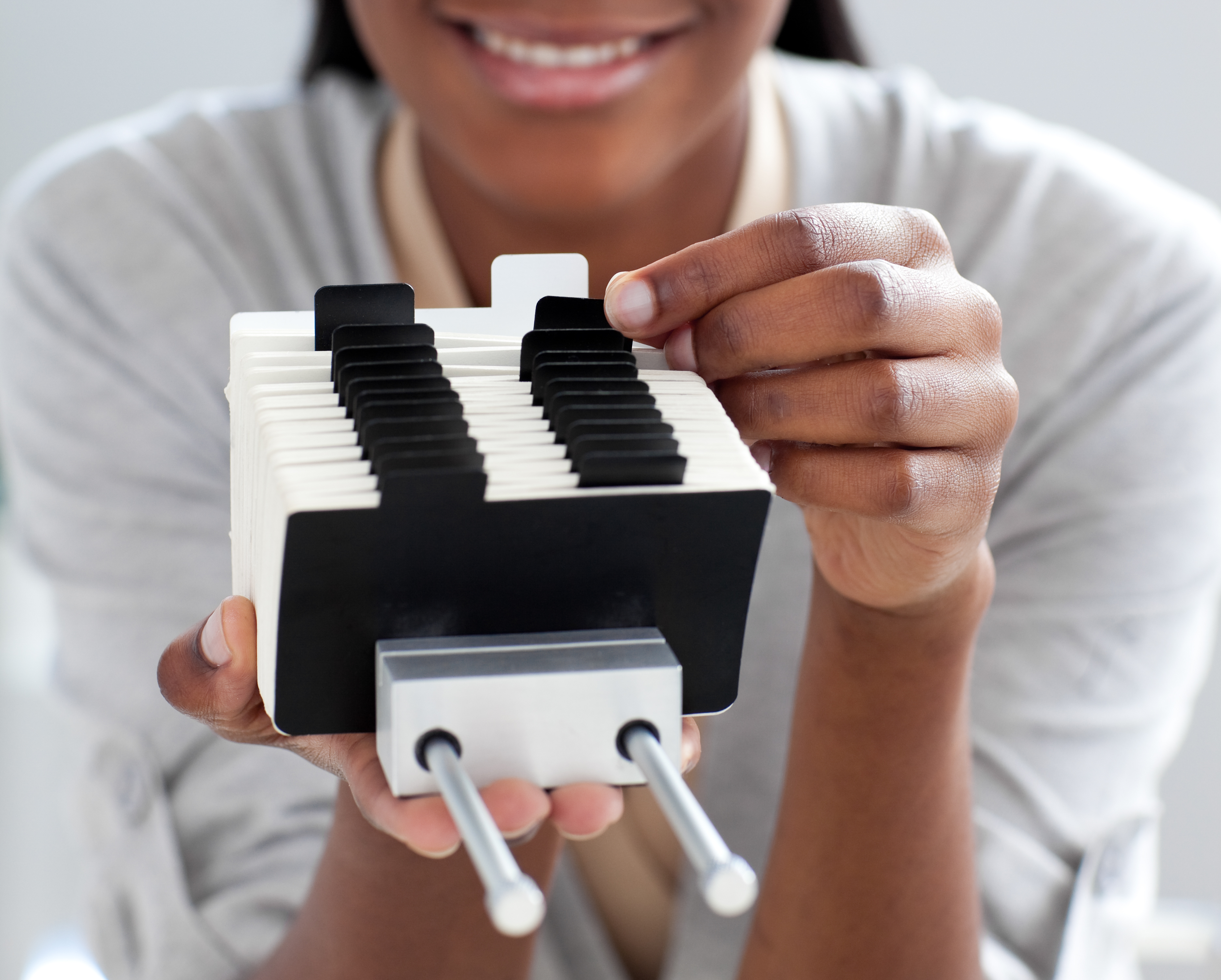 Close-up,Of,An,Afro-american,Businesswoman,Searching,For,The,Index,At